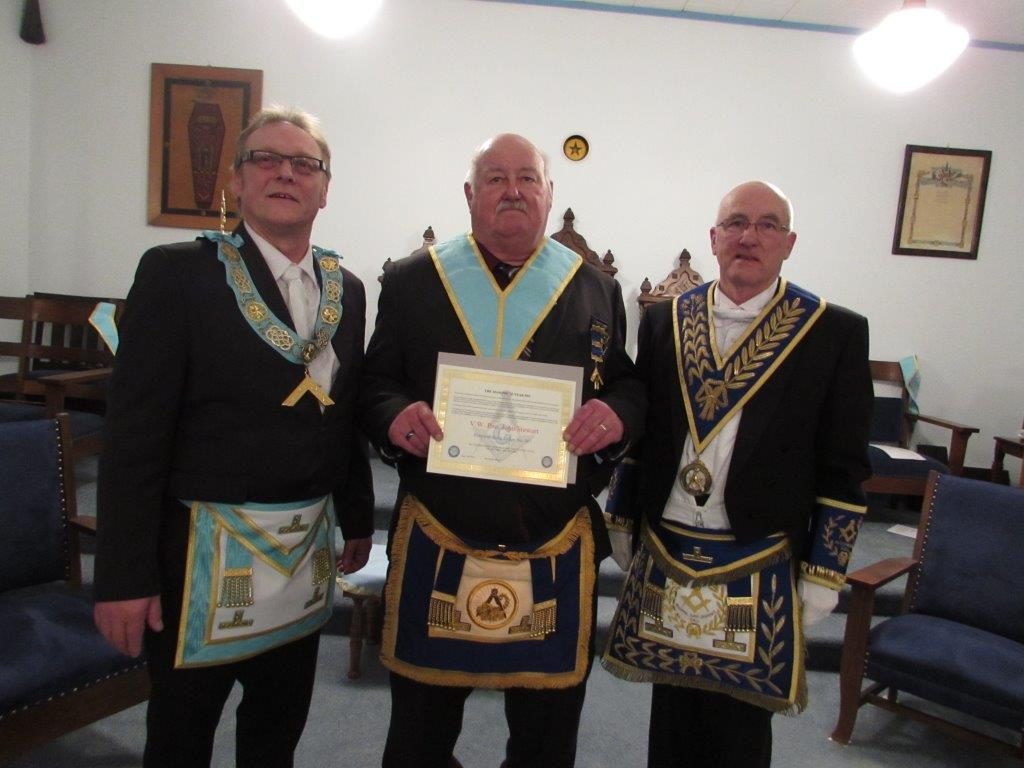 Left to Right: Worshipful Master W. Bro. Bernhard Wiesner , V.W. Bro. John Stewart receives his 25 year pin and certificate & DDGM R.W. Bro. J. Henry Lewis.